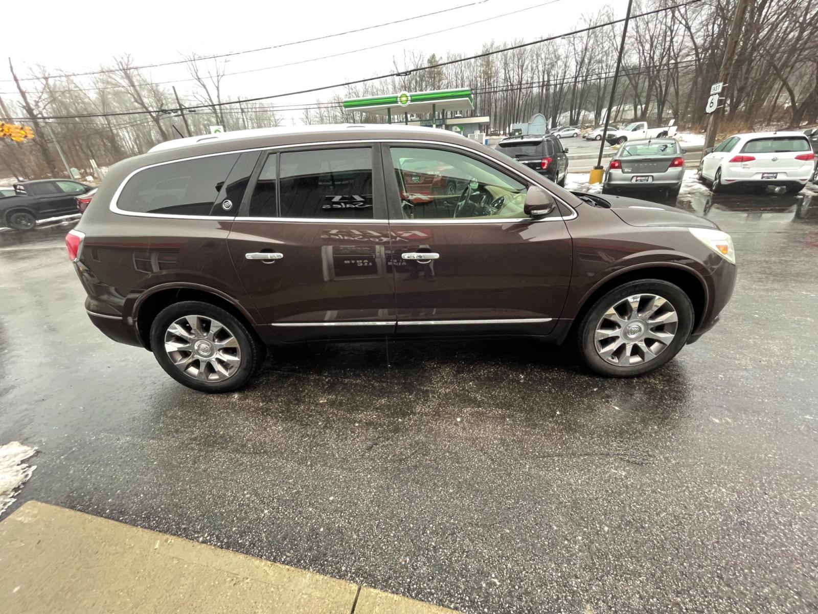 2016 Brown /Brown Buick Enclave Premium AWD (5GAKVCKD4GJ) with an 3.6L V6 DOHC 24V engine, 6A transmission, located at 547 E. Main St., Orwell, OH, 44076, (440) 437-5893, 41.535435, -80.847855 - This 2016 Buick Enclave Premium AWD boasts a luxurious range of features including single-owner status, climate-controlled leather seats, adaptive HID headlights for improved visibility, and safety features like blind spot monitoring and rear cross-traffic alert. Its towing capability is notable at - Photo #5
